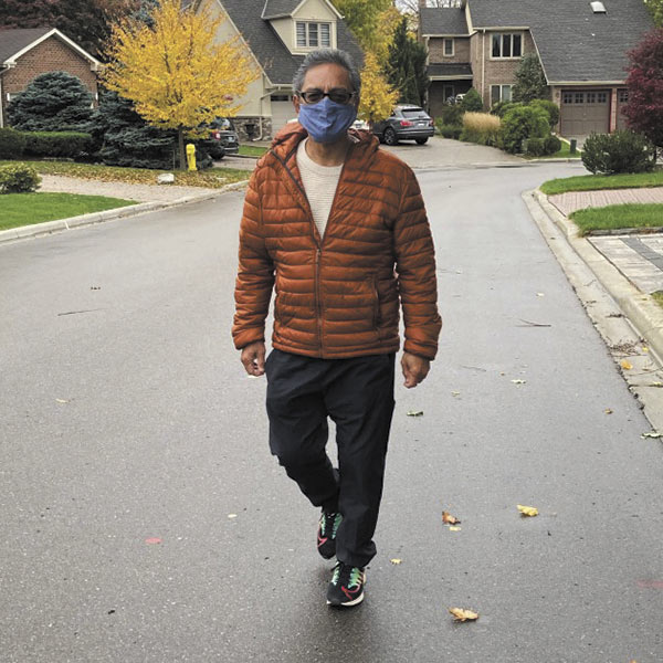 Rolando Idolor walking in his neighbourhood