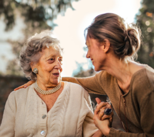 Grandmother and mother talking and smiling
